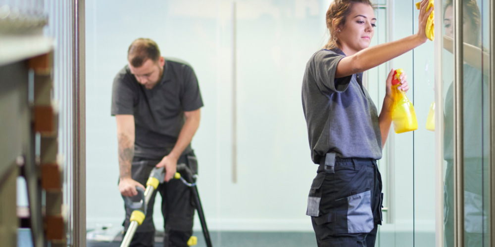 Picture of two cleaners cleaning an office