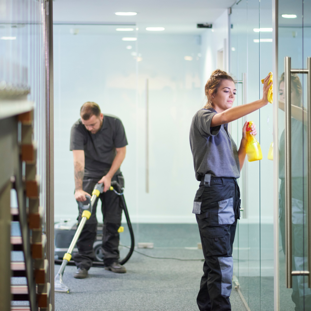 Picture of two cleaners cleaning an office